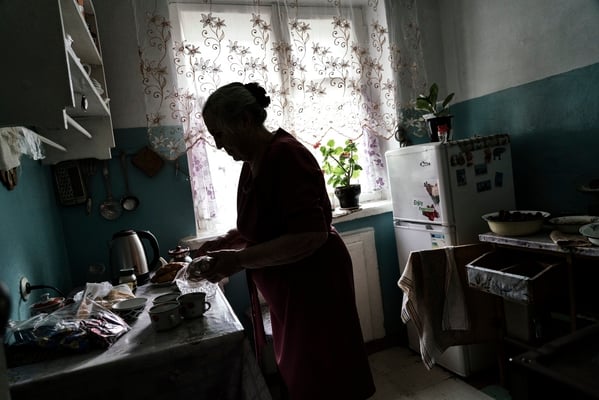 Goravanina Fedorova in her home in Kurchatov while preparing dinner. Goravanina Fedorova is living in Kurchatov town. She assisted to the nuclear explosions.