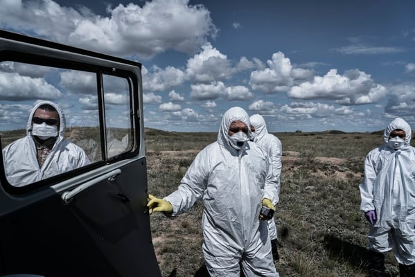 Scientists of the Kurchatov nuclear center wearing protective suits inside the polygon, close to ground zero, where the first atomic bomb was exploded on 1949.