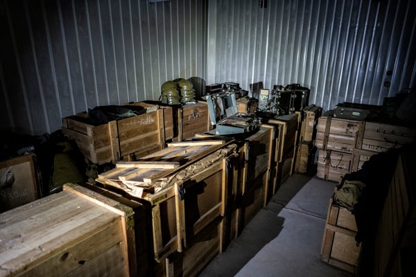 wooden boxes full of gas masks 