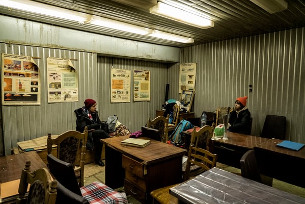 Oksana and Daria inside the bunker as they wait for the air raid alarm to go off. 