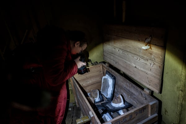 A tourist while taking pictures inside the bunker. 