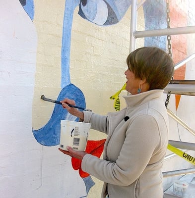 Here come the neighborhood helpers. This is Candy Kruesi getting her brush wet!