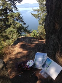 Paintings against a tree, near the Canadian border.
