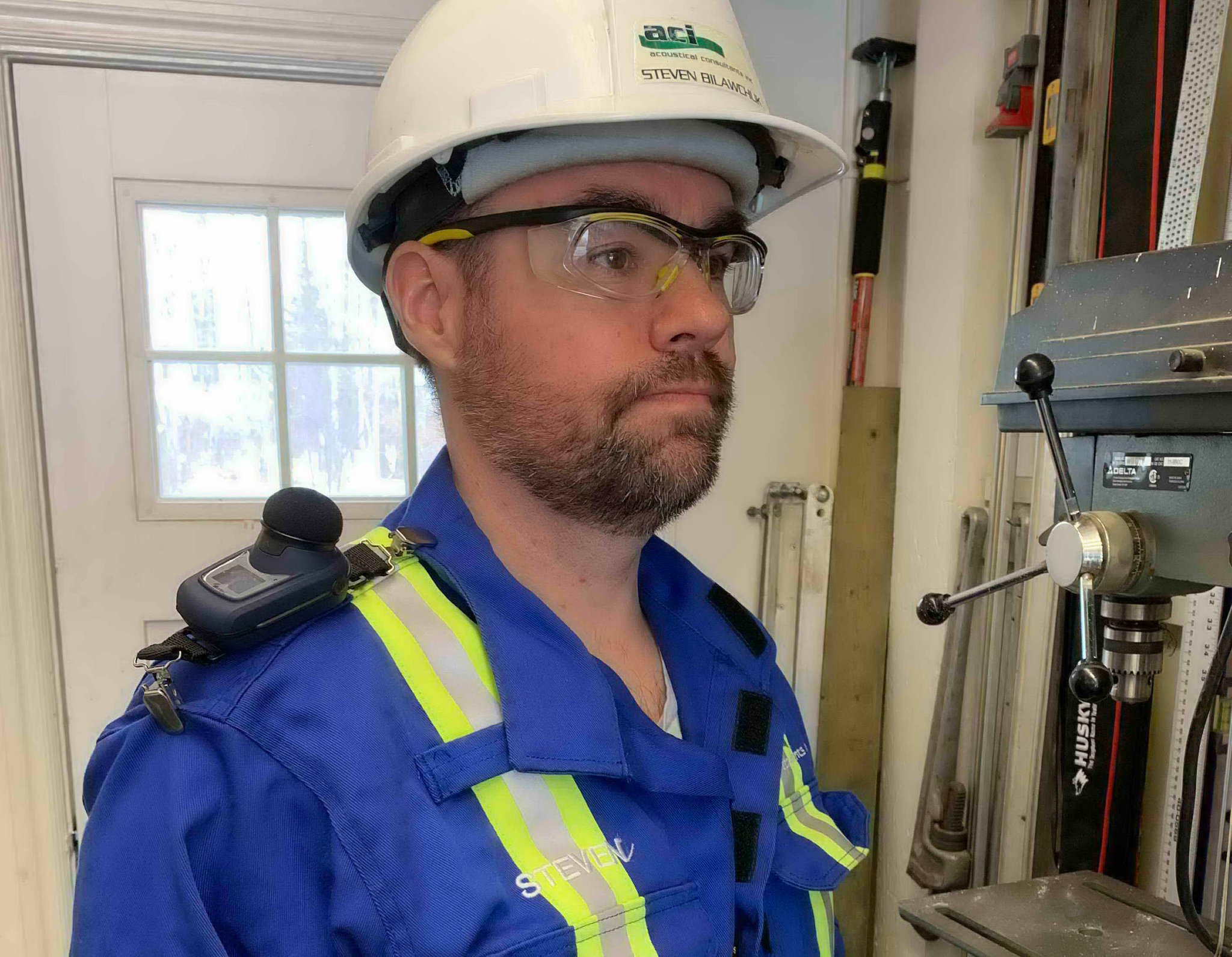 Worker Wearing Noise Dosimeter