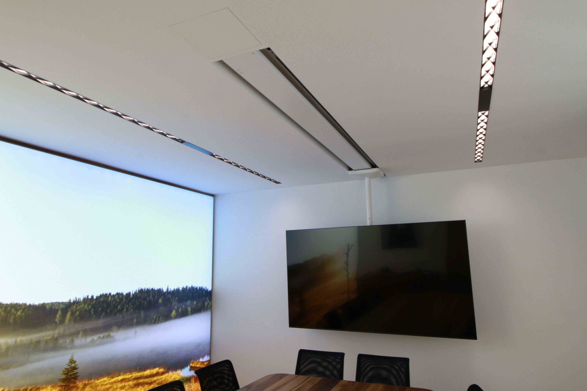 Slidable TV ceiling holder in meeting room
