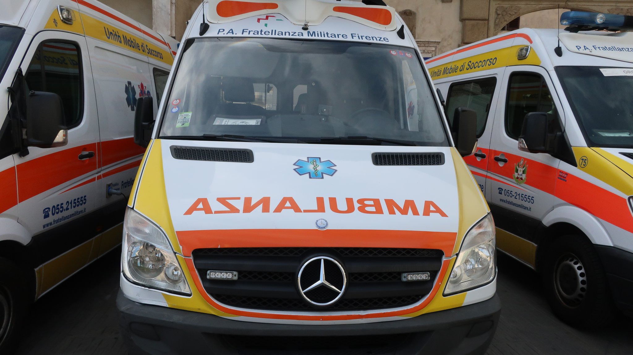 An ambulance of the church. "AMBULANZA" is written in reverse.