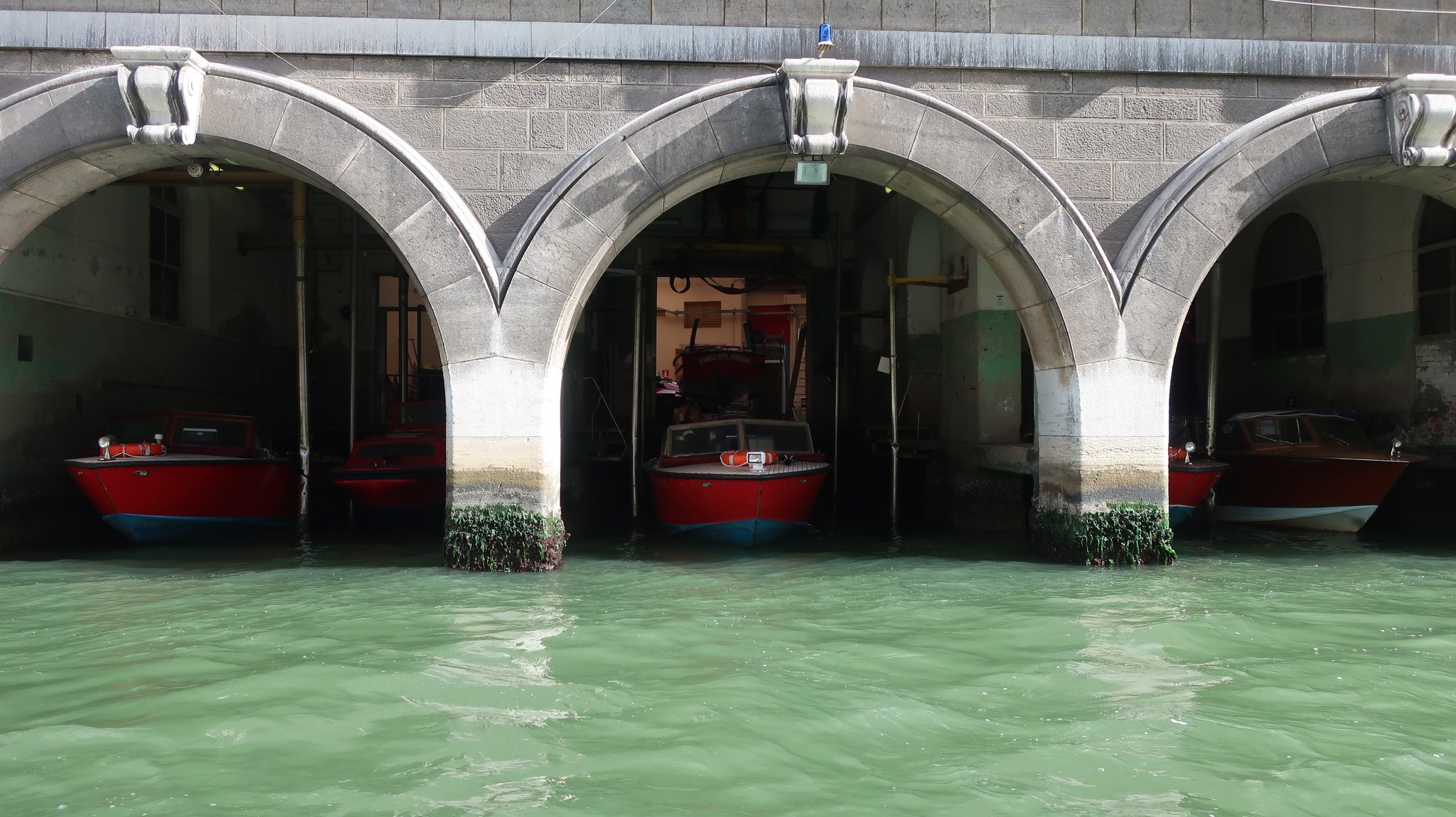 A fire station. Firefighting boats are moored.