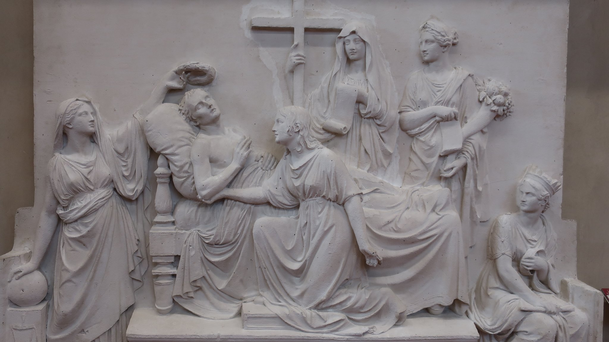 A relief sculpture depicting a deathbed scene 