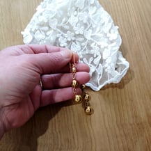 Perles or montées en girandole