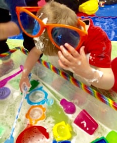 Child in messy play