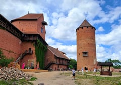 Red brick Turaida Castle buildings with blue sky