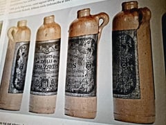 Historic yellow coloured bottles of Riga Black Balsam