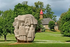 Monolithic stone sculpture of peasant women in Dainu kalns folklore park, Turaida, Latvia