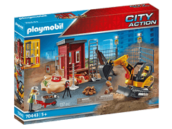 Minibagger mit Baugrube und Bauarbeiter.