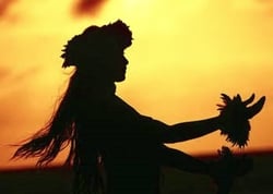 A creative and harmonious photo of a Hawaiian lady hula dancing on the beach at sun set, hearing the sound of the waves.