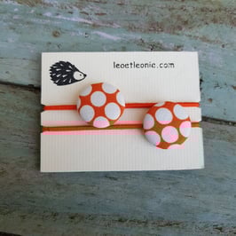 Élastique à cheveux Orange à gros pois blancs