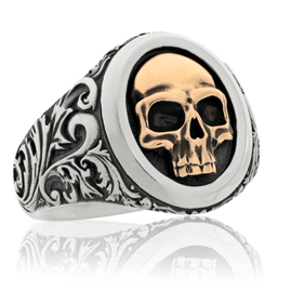 Herren Ring in Edelstahl mit einem Schädel-Motiv in Rotgold aus der Männerschmuck Kollektion der Goldschmiede OBSESSION Zürich und Wetzikon.