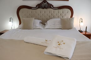 Comfortable double room at Palata Venezia Ulcinj with cozy bed, plush bedding, and stylish decor.