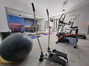 Modern gym equipment and workout facilities available at Palata Venezia’s mini fitness center