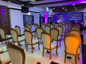 Hybrid event setup at Palata Venezia, Ulcinj, showcasing comfortable seating, vibrant lighting, and video conferencing facilities