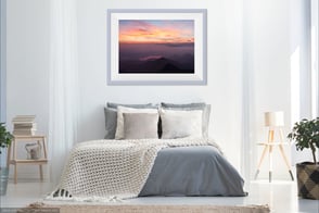 Photo of a bedroom with a Delphicaphoto fine art print on the wall