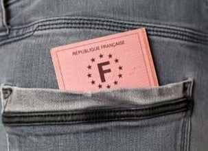 A French paper driving licence in a jeans pocket