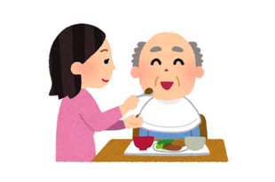 食事を介助している様子のイラスト