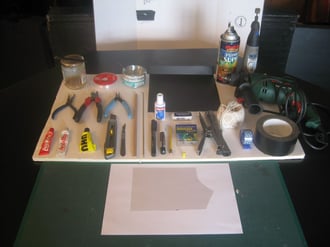 1)Evostick, thread, wire, plastic, paint, Dremel (2) pliers, Tippex, rubber, string, drill, (3) glues, craft knife, scalpel, dowel, bike spoke, markers, pencil, push pins, stapler, selotape, gaffer tape, (4) cutting board, paper, transparent plastic.