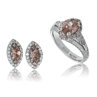 Ring und Orstecker in Weissgold mit weissen und pinken Diamanten aus der Gremlin Kollektion, angefertigt auf Kundenwunsch von der Goldschmiede OBSESSION Zürich und Wetzikon 