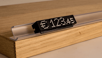 Modulprofil selbstklebend transparent 47° mit schwarzem TAXOM 800 Preismodul