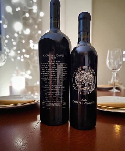 Image of two 750ml bottles of the Oakville Cuvee showing front and back etched labels