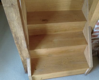 The first few steps of a timber staircase