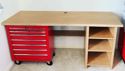 picture of the desk with just the metal tool box and basic worktop and shelves
