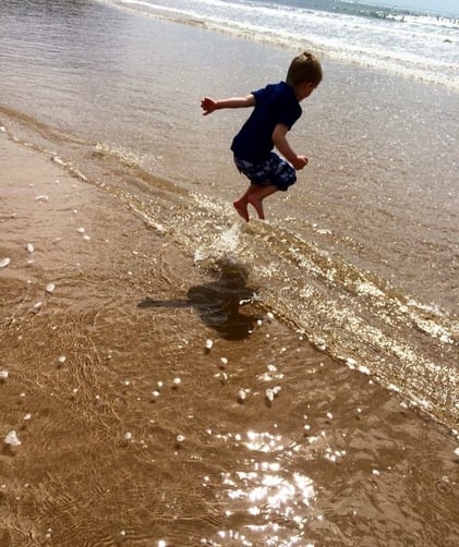 Boy playing in the sea