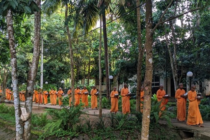 The Nuns on their way to have lunch. They bring their own bowl and wash it also themselves.