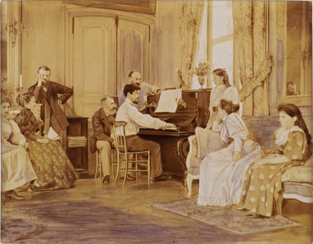 Debussy al piano. Tras él, el compositor Ernest Chausson, 1893. (Albumen print enhanced with violet ink, mounted on cardboard, August 1893 -photographer unknown-)