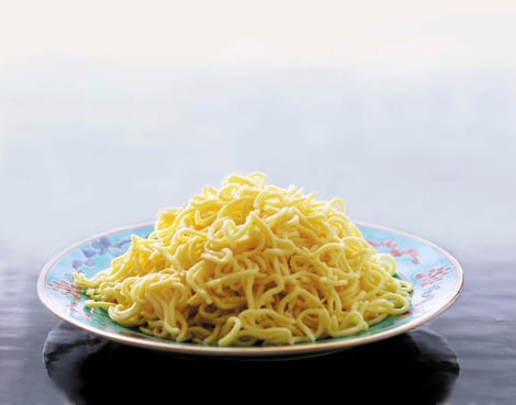 yellow mee on a plate