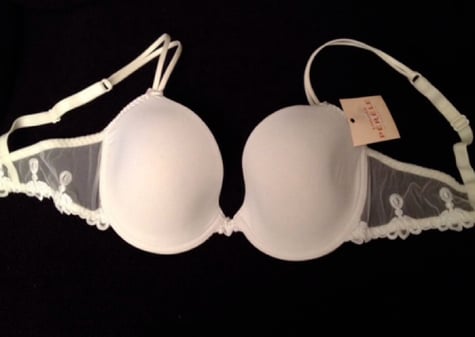 White bra on a black background.