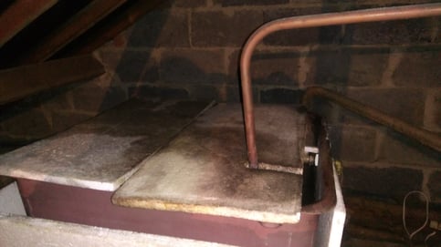 Picture of a cold water cistern in a roof void