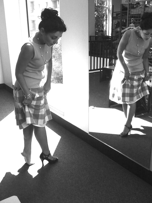 Black and White photo of Renata trying on shoes