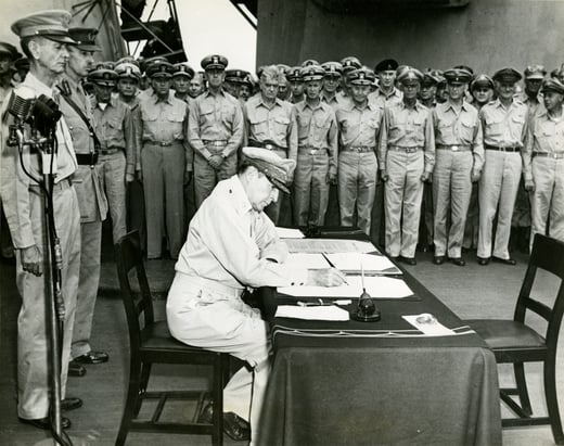 General Douglas MacArthur signs the Japanese surrender with a Parker Duofold pen on 2 September 1945