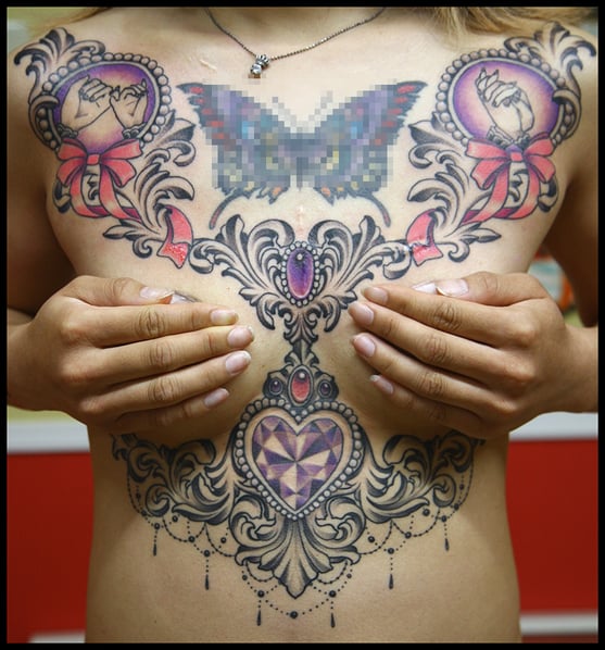 Chest and Under Booby Tattoo 