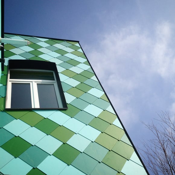 old house in a new jacket, colorful outside wall in blue and green