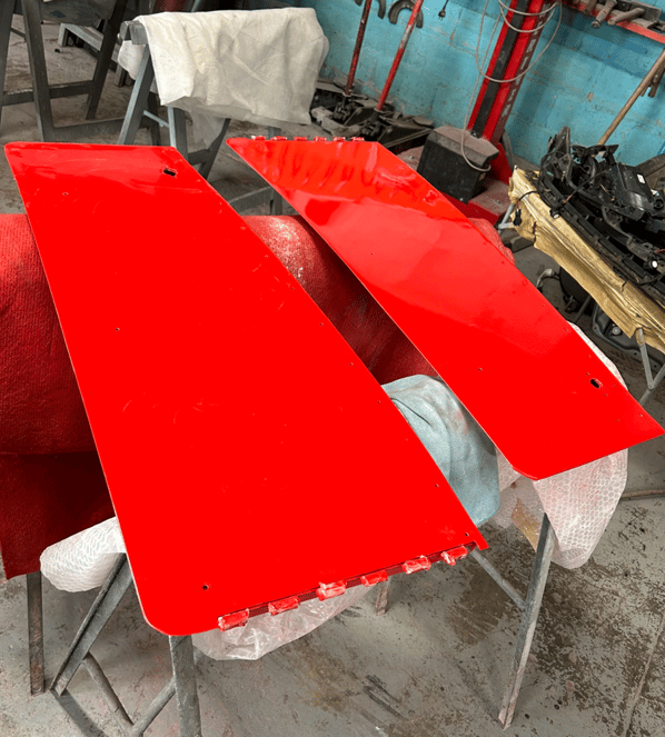 First coat of red paint on the Spartan doors