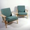 Easy chairs design Hans J Wegner for Getama mod. GE-290. Frame in natural oak with reupholstered cushions in wool fabric 'Hallingdal' from Kvadrat. H.73cm.