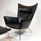 Armchair with ottoman design Hans J Wegner for AP-stolen/Johs. Hansen mod. AP-45. ReUpholstered in full-grain aniline leather from Elmo. H.102cm.