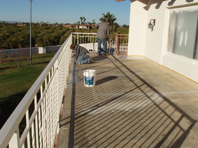 Brushing and rolling Ceramic InsulSeal around railing