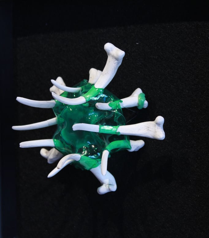 "Petro-tarsals"; 2018; ceramic, PET plastic, felt, frame; 9x9x2