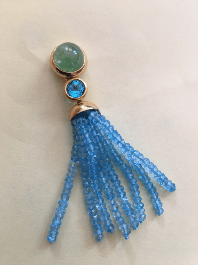 Oslo mit Tsavorith P.a.A., Zwischenstück Apathit € 360,00,Quaste swiss blue Topas € 590,00