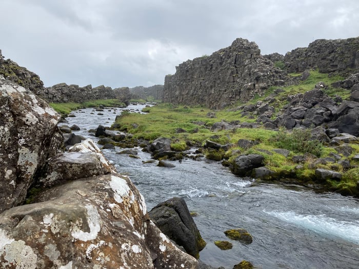 The Oxara River flowing through the mighty Almannagja Rift.